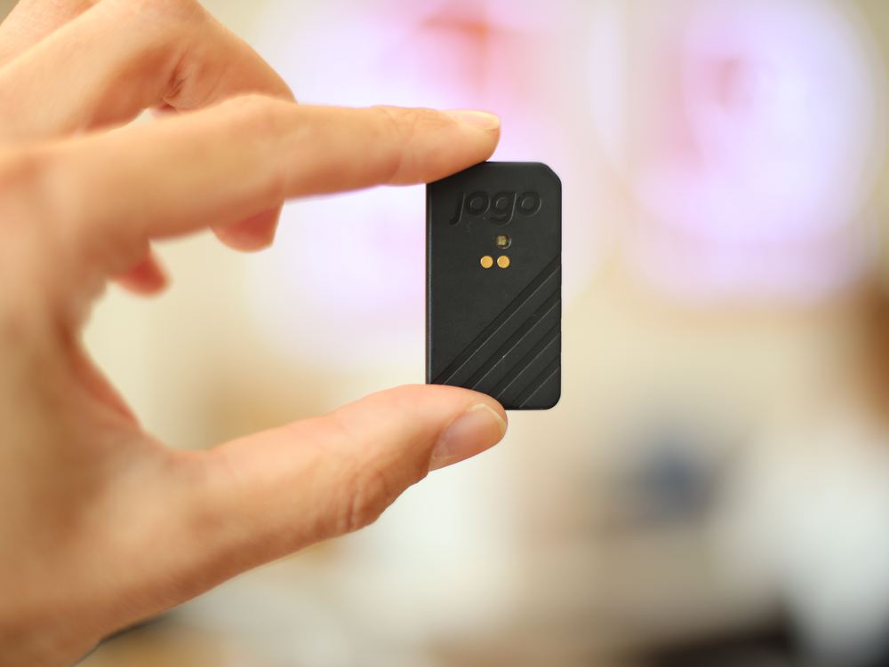 The sensor in hand — small enough to disappear into the shoe.